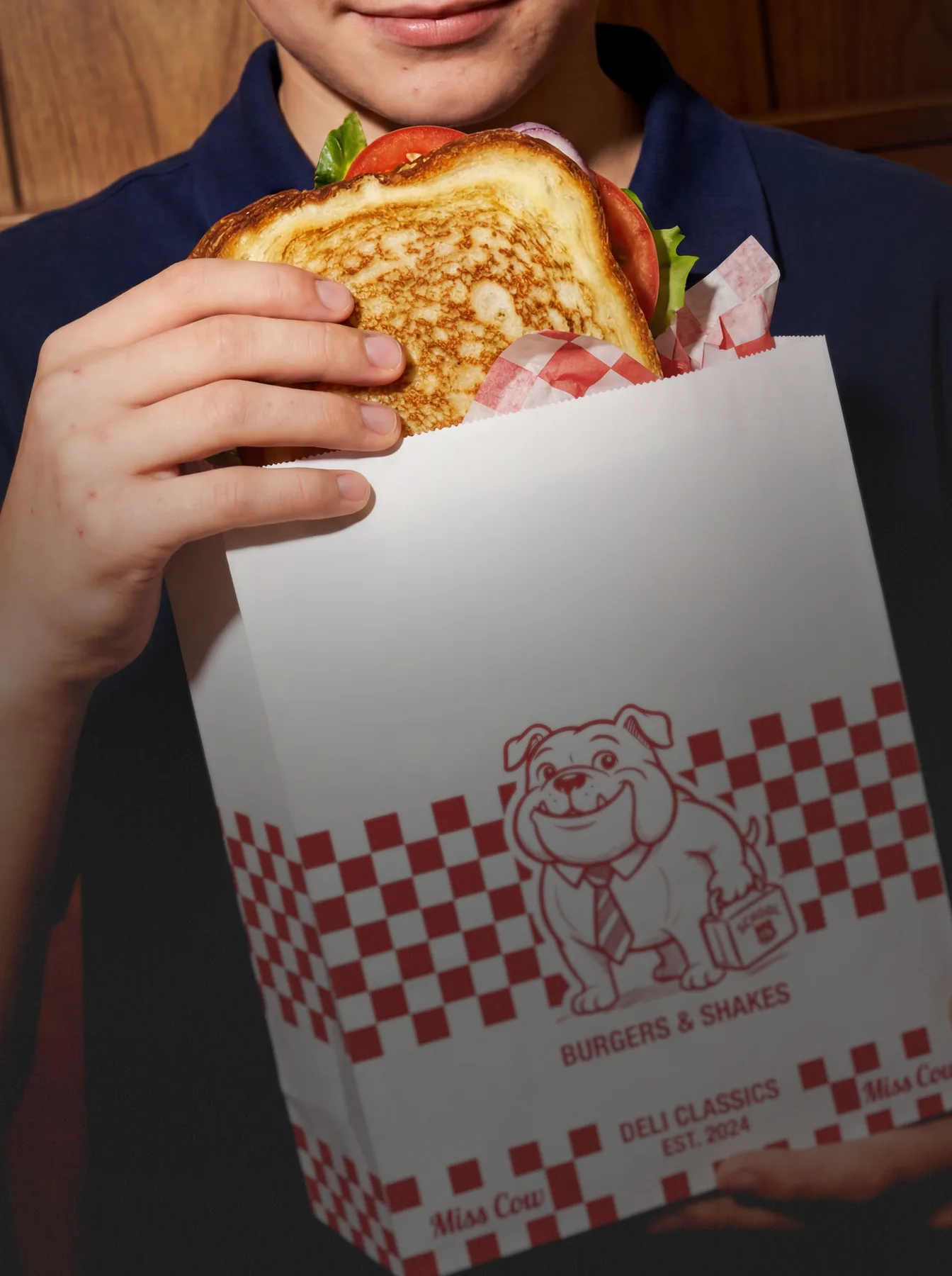 Student holding a restaurant lunch ordered through Buy My Lunch